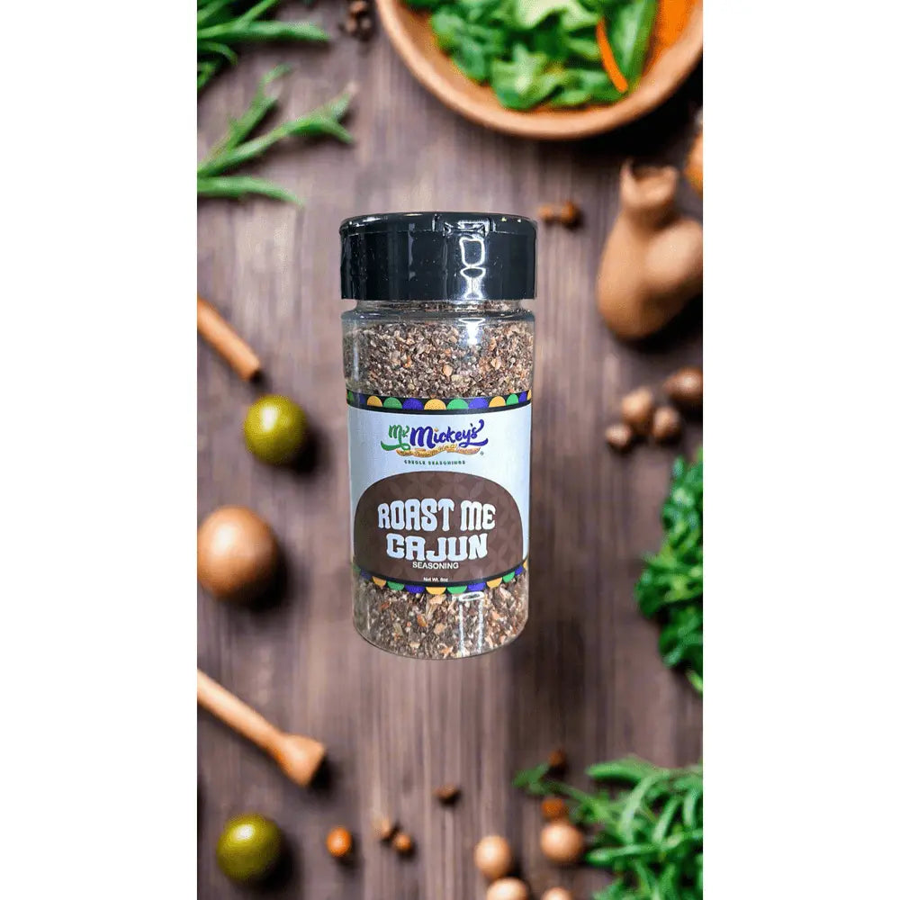 Roast Me Cajun seasoning sprinkled over roasted vegetables and grilled meats